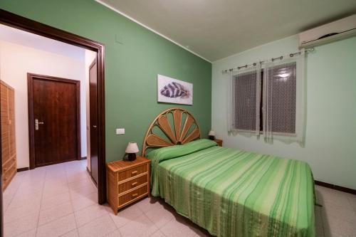 A bed or beds in a room at Residence l'Ogliastro