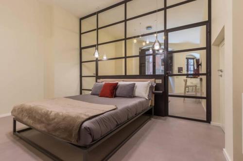 Giường trong phòng chung tại Suite Cagliari -99-