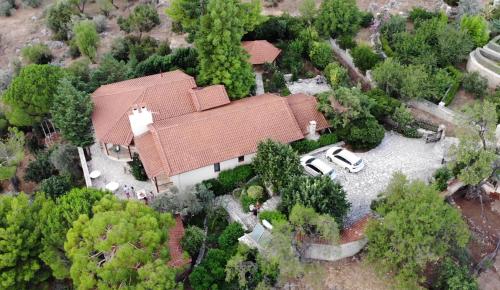 an overhead view of a house with a roof at Private Villa with Panoramic View in Ayía Evthimía