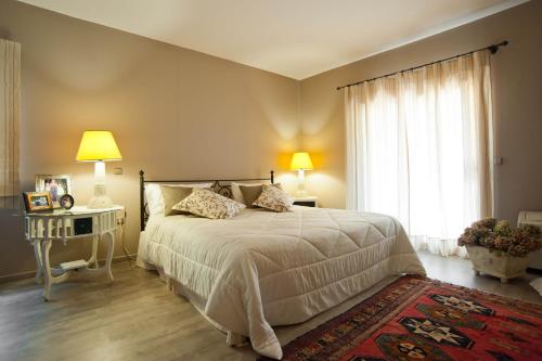 a bedroom with a large bed and a window at Private Villa with Panoramic View in Ayía Evthimía
