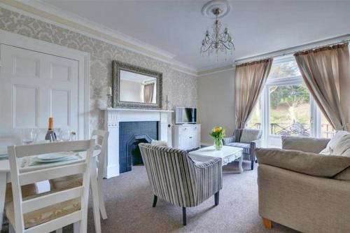 a living room with a couch and a table at Pannett View in Whitby