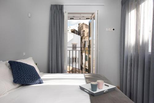 Posteľ alebo postele v izbe v ubytovaní Volto Kokkini Apartment