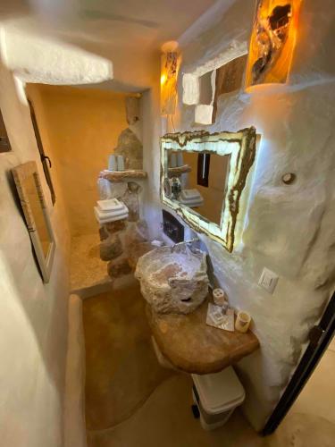 an overhead view of a bathroom with a sink and mirror at Sueños Tulum in Tulum
