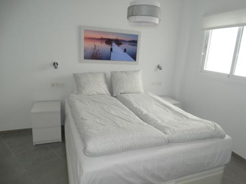 Posteľ alebo postele v izbe v ubytovaní Málaga Apartamentos - Jinetes, 23
