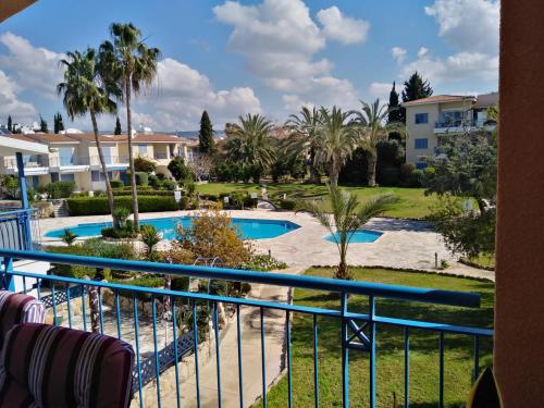 a view of a pool from a balcony of a resort at Paradise Gardens II Anastasia Apartment in Paphos