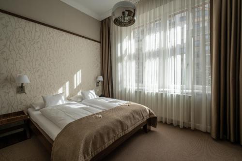 
Posteľ alebo postele v izbe v ubytovaní Villa Meribel
