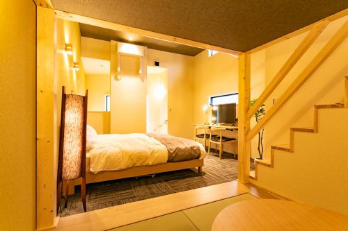 Кровать или кровати в номере Sakura Stay Keikyukamata