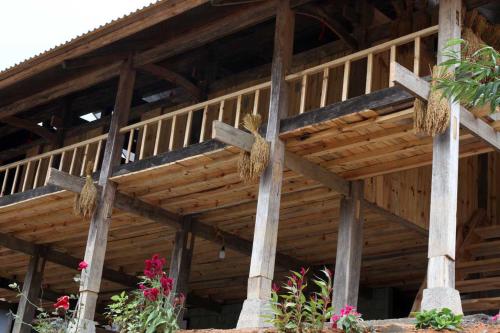 a wooden building with wooden crosses on it at Nậm Lỳ Retreat in Ha Giang