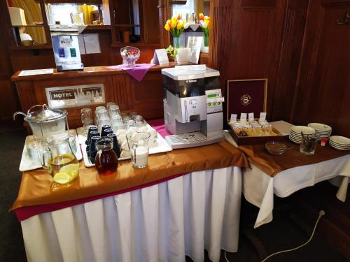 a table with a coffee maker on top of it at Tourist room Maria in Ostrava