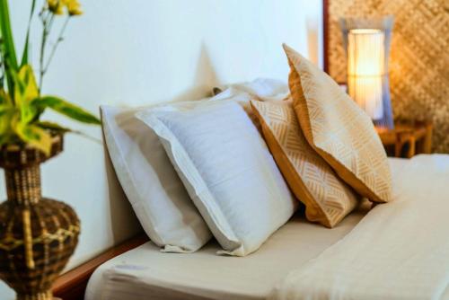 Ένα ή περισσότερα κρεβάτια σε δωμάτιο στο Romantic Beach Villas