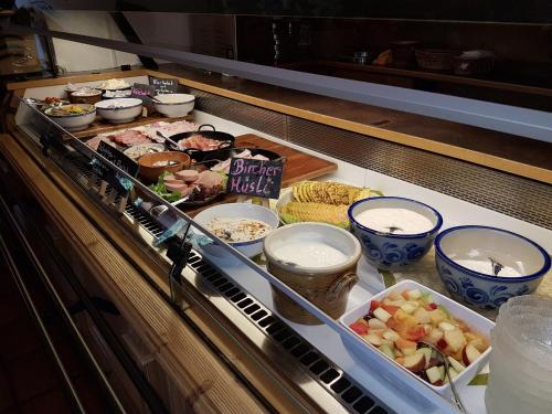 a buffet with many different types of food and drinks at Gröbl-Alm in Mittenwald