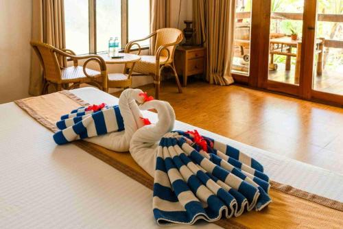 Ένα ή περισσότερα κρεβάτια σε δωμάτιο στο Romantic Beach Villas