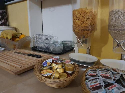 a table with baskets of food and snacks on it at Ferienwohnungen Wallis - Randa bei Zermatt in Randa