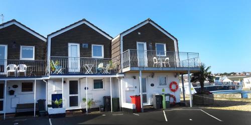 a row of houses with balconies on top of them at Aisla Cottage • East Cowes • Isle of Wight in East Cowes