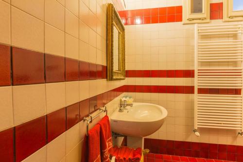 a bathroom with a sink and a mirror at Villa Anna Maria in Centobuchi