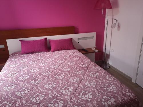 Katil atau katil-katil dalam bilik di Residencial S Juliao AL