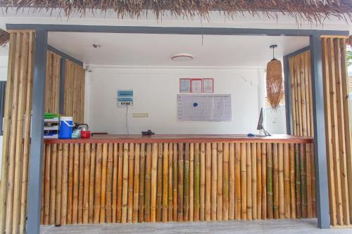 a bar in a room with wooden dividers at Bohol Sojourn Villa Alona in Panglao