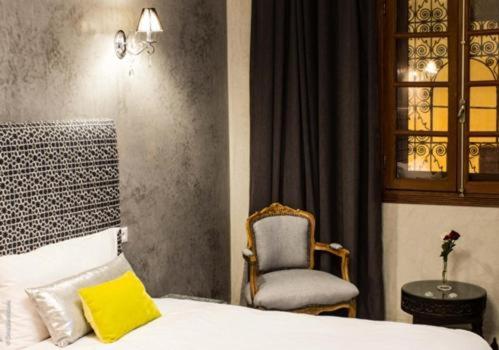 Ein Bett oder Betten in einem Zimmer der Unterkunft Riad Yacout
