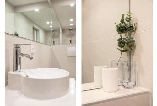 two pictures of a bathroom with a sink and a mirror at 2 rooms Sea Breeze loft apartment II terrace family Scheveningen The Hague in Scheveningen