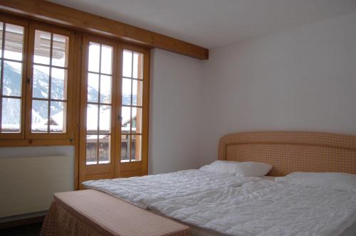 Säng eller sängar i ett rum på Chalet Obelix