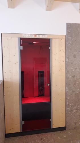 a room with a red bench inside of a room at Alpenappartement Kleiner in Tannheim