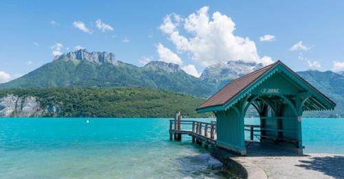 a gazebo sitting in the middle of a lake at L'appartement d'Anna in Annecy