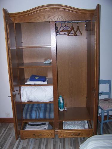a room with a wooden bunk bed with shelves at Gite en Forterre in Druyes-les-Belles-Fontaines
