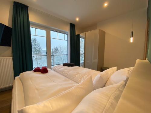 Letto o letti in una camera di Braunlage Lodge