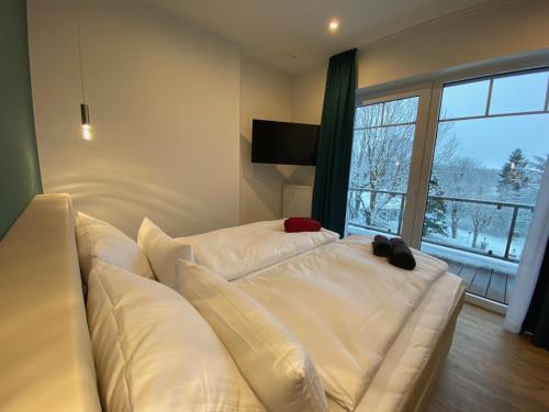 Letto o letti in una camera di Braunlage Lodge