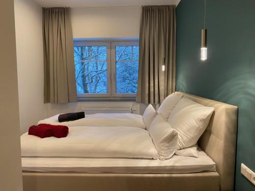 Letto o letti in una camera di Braunlage Lodge