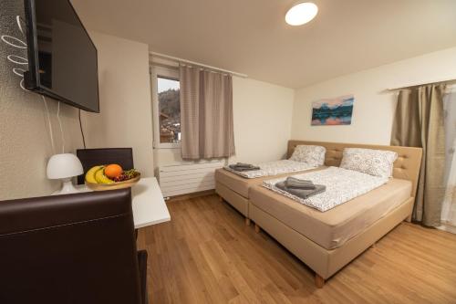 Postel nebo postele na pokoji v ubytování Haus Astoria