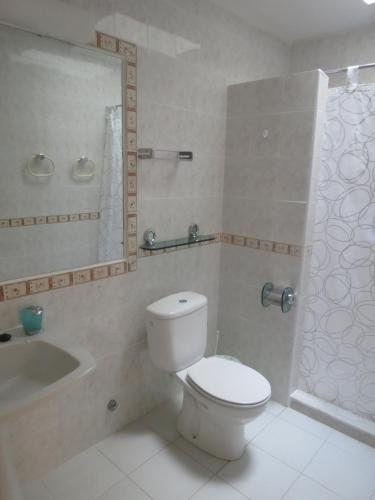 a bathroom with a toilet and a sink and a shower at Vv Apartamento Gran Vista Colony Club in Puerto del Carmen