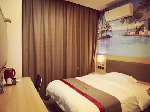 a hotel room with a bed and a large window at Thank Inn Chain Hotel Jiangsu Suzhou Taihu Lake Dongshan Town in Suzhou