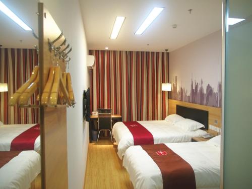 Postel nebo postele na pokoji v ubytování Thank Inn Chain Hotel jiangsu xuzhou xinyi nanjing road