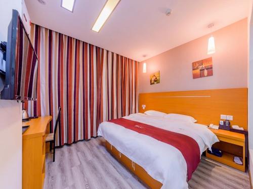 Ένα ή περισσότερα κρεβάτια σε δωμάτιο στο Thank Inn Chain Hotel Guangdong Guangzhou Baiyun International Airport