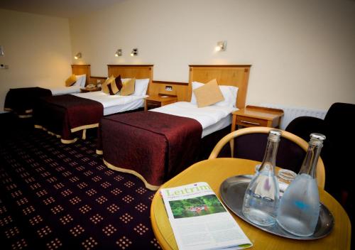Postel nebo postele na pokoji v ubytování Bush Hotel