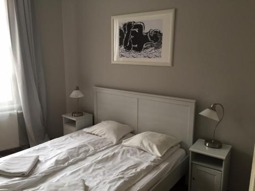 Floriańska Grand Apartment 2 tesisinde bir odada yatak veya yataklar