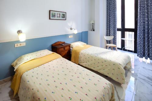 Postel nebo postele na pokoji v ubytování Peña 5 Apartments