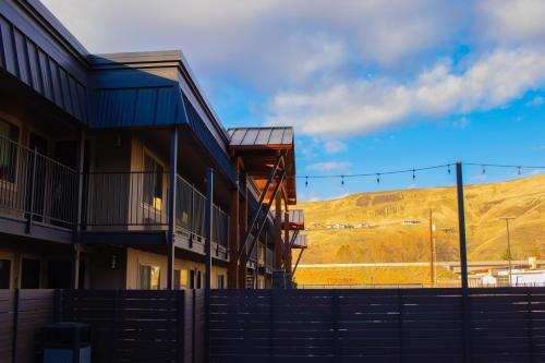 a group of buildings with a hill in the background at The Hotel Y in Yakima