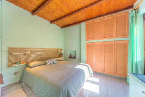 Giường trong phòng chung tại Ortigia San Pietro Apartment