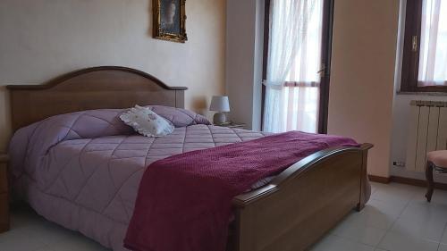 Postel nebo postele na pokoji v ubytování casa nonna Dina