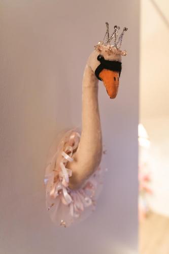 a fake swan with a crown on a wall at The Rose & Crown in Godalming