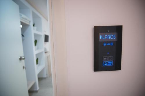 a smart phone hanging on a wall in a room at Afrodite Luxury Rooms in Telendos