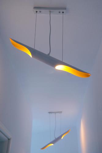 a pair of scissors hanging from a ceiling at Afrodite Luxury Rooms in Telendos