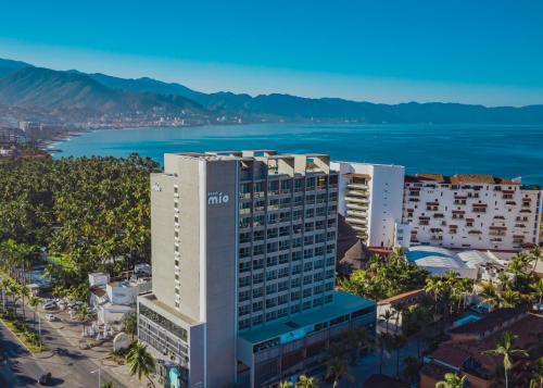 an aerial view of a building with the ocean in the background at Hotel Mio Vallarta Unique & Different- Adults Only in Puerto Vallarta
