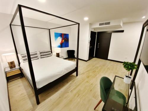 a bedroom with a bed and a desk and a chair at La SIGRINA Tuy in Tui