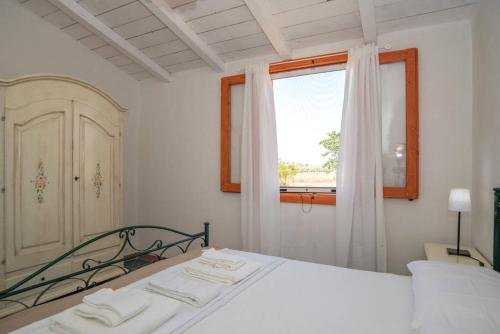 Postel nebo postele na pokoji v ubytování Agriturismo Agrimaccari Marzamemi-Vendicari - Esperienza autentica siciliana