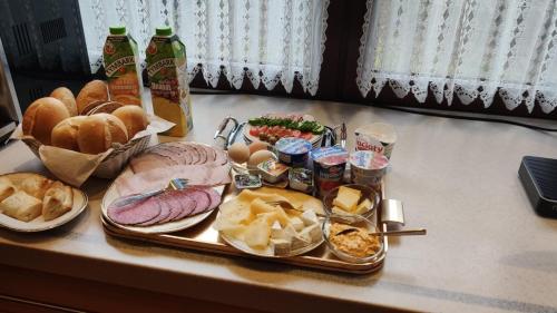 a tray of food with different types of food on a counter at Apartament Relax in Skawina