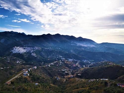 a view of a town in the mountains at Apartamentos Alma y Montaña in Cómpeta