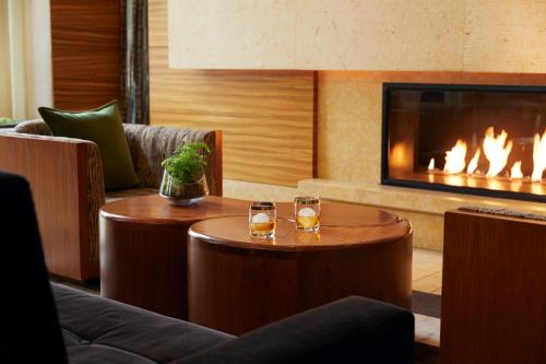 a living room filled with furniture and a fire place at Pan Pacific Seattle in Seattle